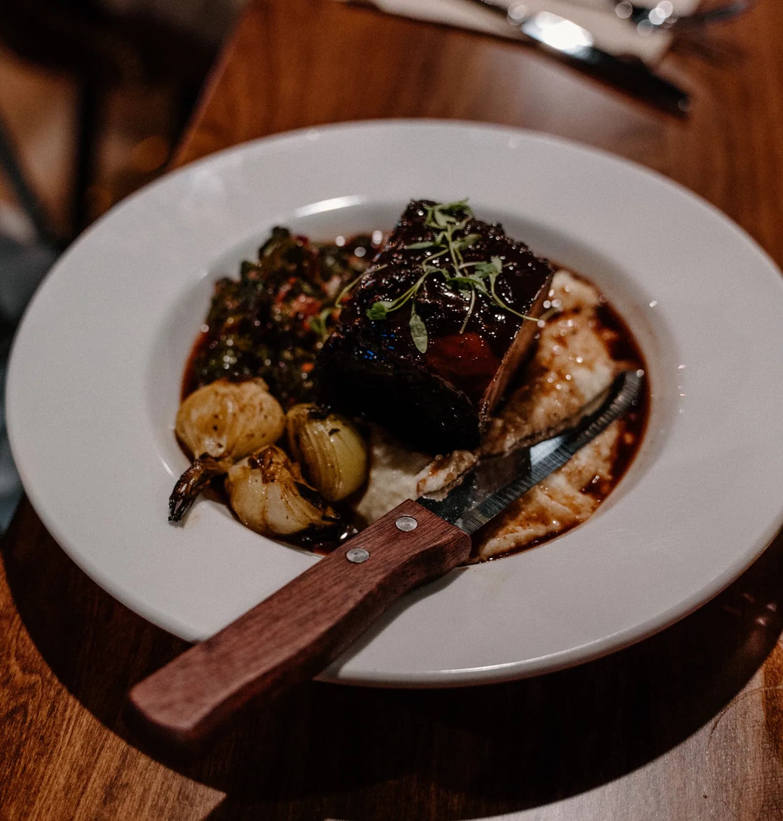 Hearty plated main — menu direction photography